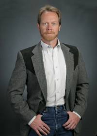 Guy Smith | Gun Facts | standing in yoke jacket